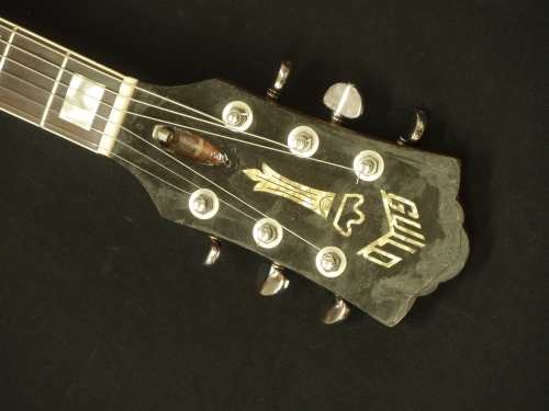 Guild S-100 faceplate before repair