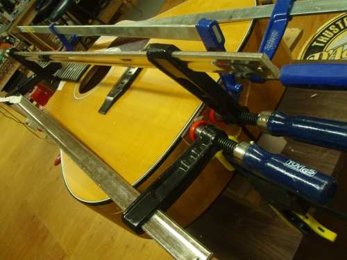 Gluing the cracks on the butt and the tailblock to the sides.