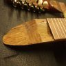 The missing wood under the fingerboard was filled before putting the charango back together to ensure as much gluing surface as possble.
