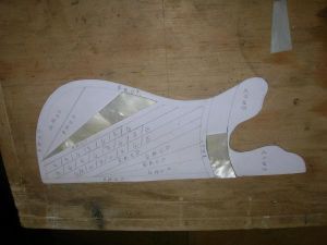 Replicating a new pick guard with black and white mother of pearl.