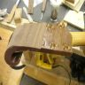 Piecing in the matching wenge veneer on the Huttl headstock.